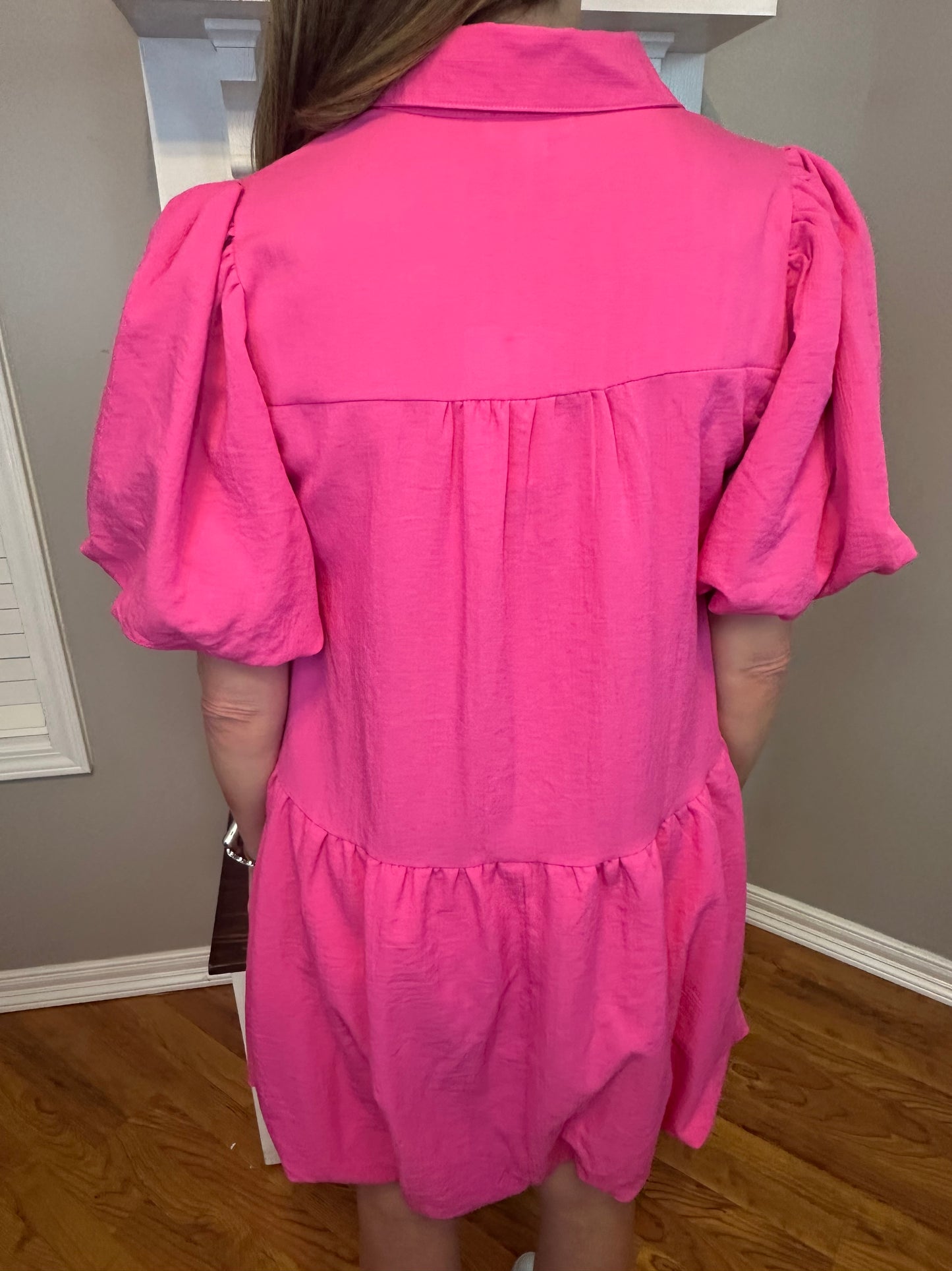 Hot pink solid collared button up dress featuring bubble hem and sleeves.