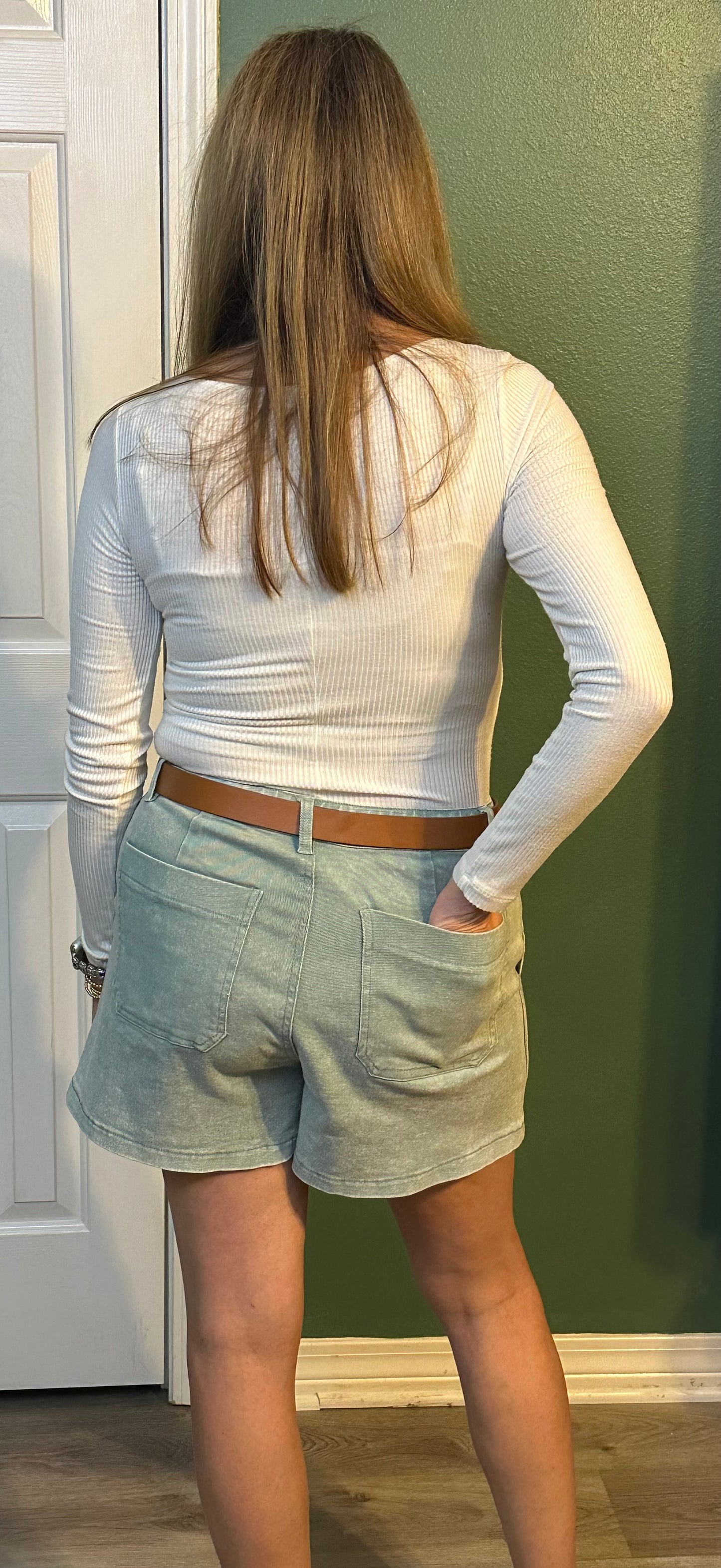 Sea foam Colored high waisted denim shorts featuring pockets at side.
