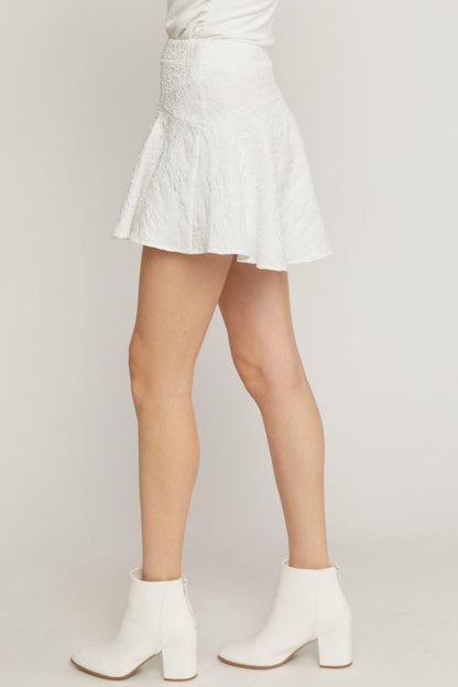 White solid textured flare mini skirt featuring inset shorts. image 2