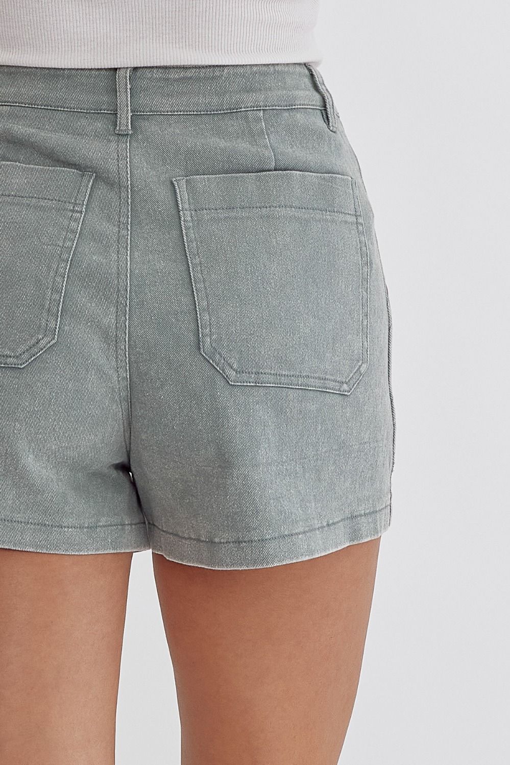 Sea foam Colored high waisted denim shorts featuring pockets at side.  image 6