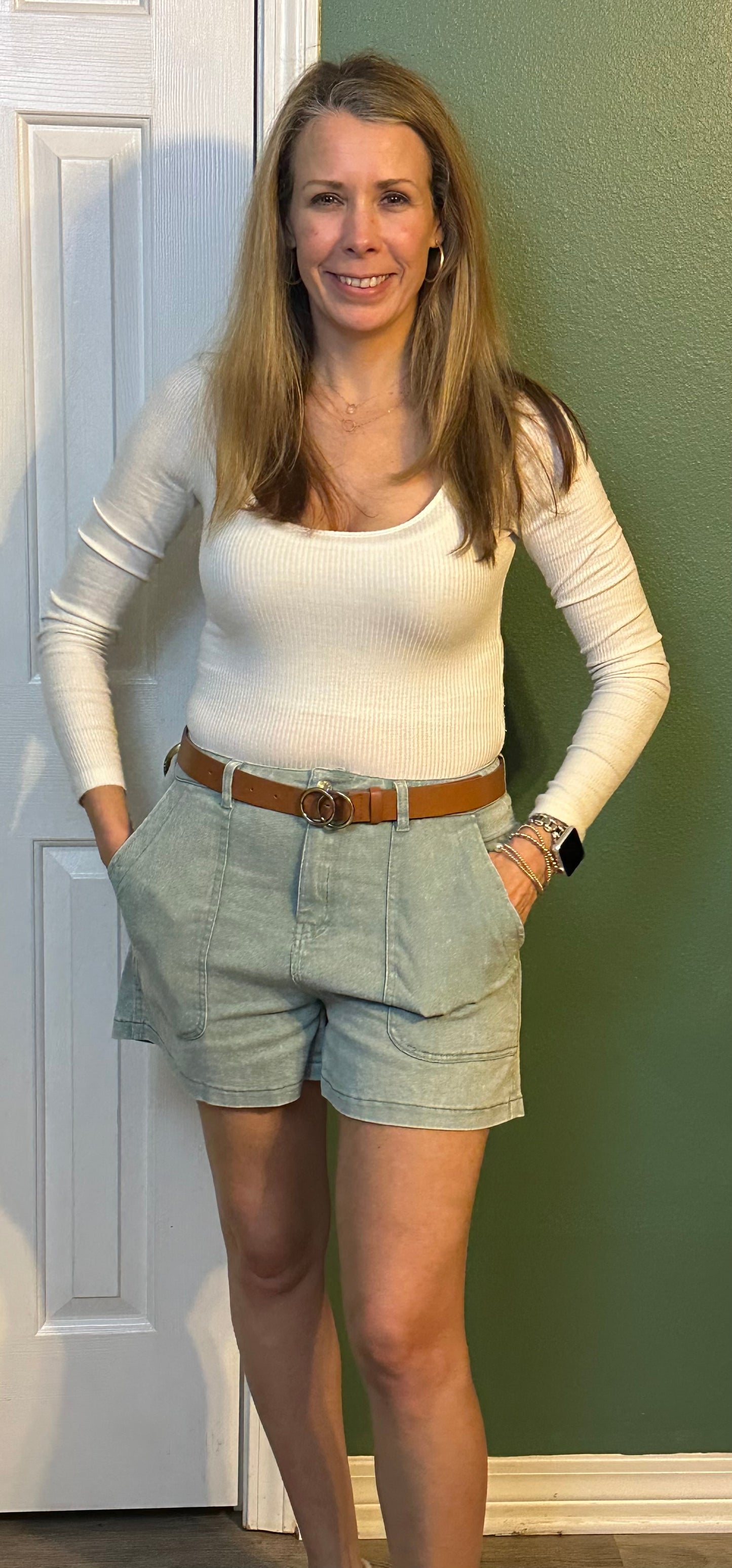 Sea foam Colored high waisted denim shorts featuring pockets at side.