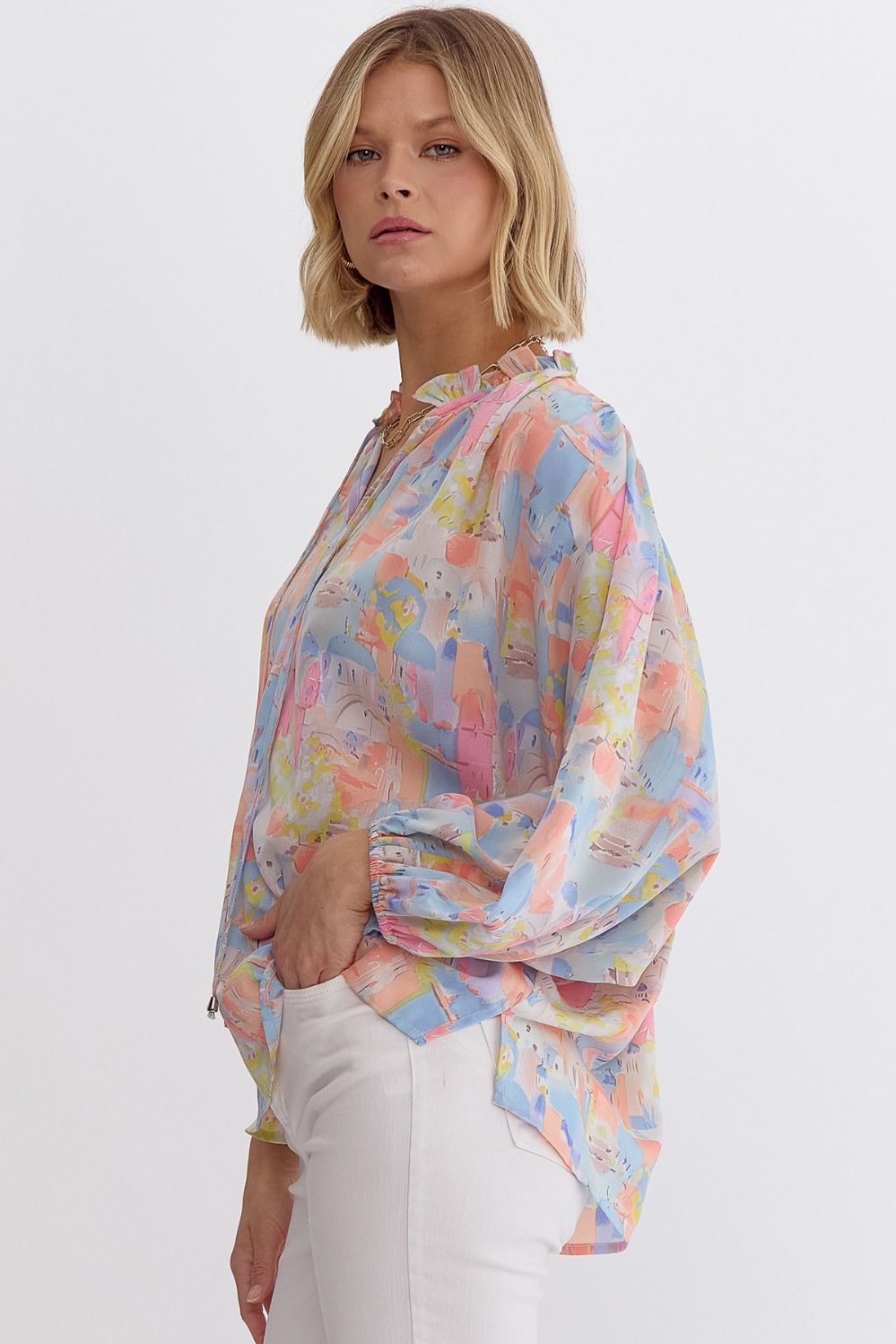 Pink multi printed v-neck 3/4 sleeve top featuring ruffle detail at neck.  image 4
