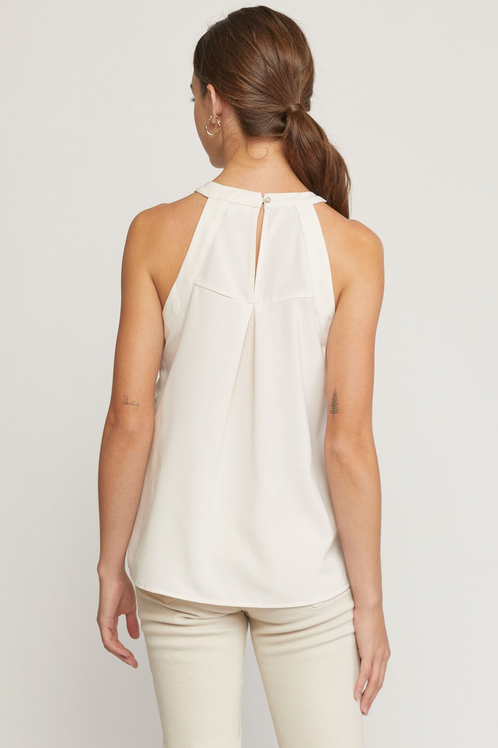 Solid halter neck sleeveless top featuring crochet detail at front. image 3
