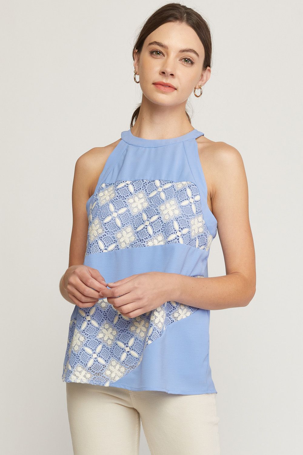 Periwinkle solid halter neck sleeveless top featuring crochet detail at front.  image 0