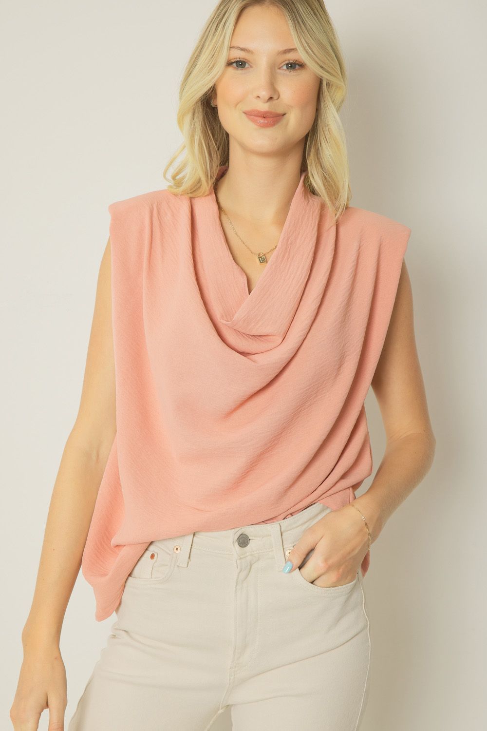 Salmon solid cowl neck sleeveless top featuring shoulder pads. Unlined. Woven. image 0
