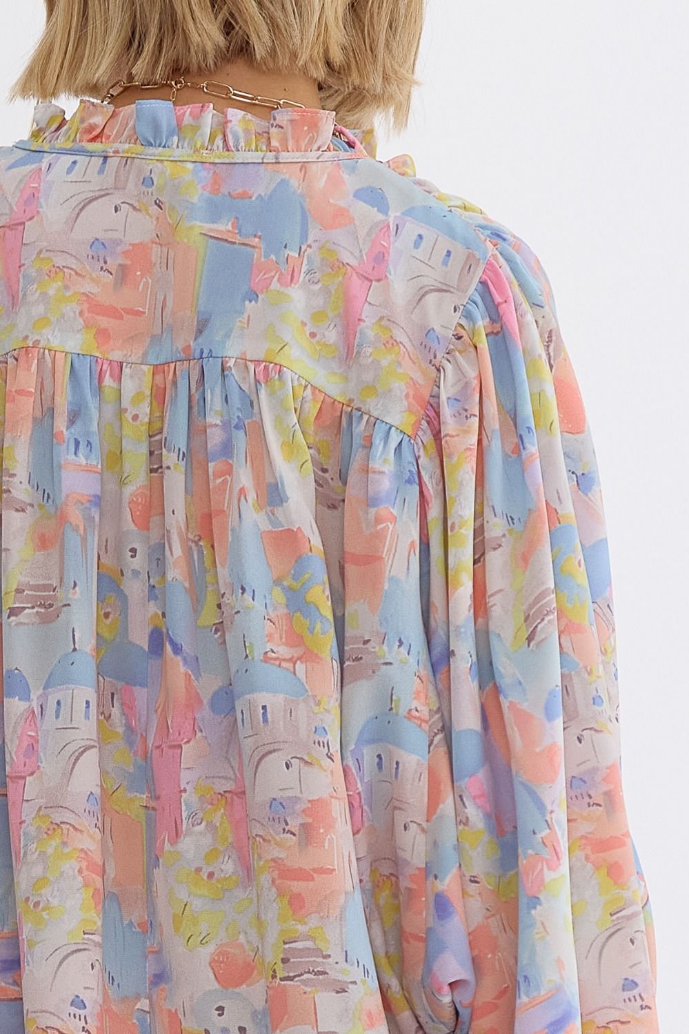 Pink multi printed v-neck 3/4 sleeve top featuring ruffle detail at neck.  image 2