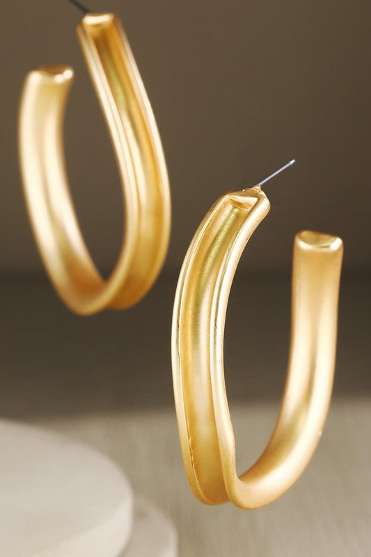 Gold oval hoop earrings image 0