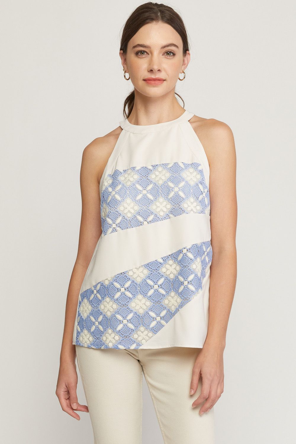 Solid halter neck sleeveless top featuring crochet detail at front. image 0