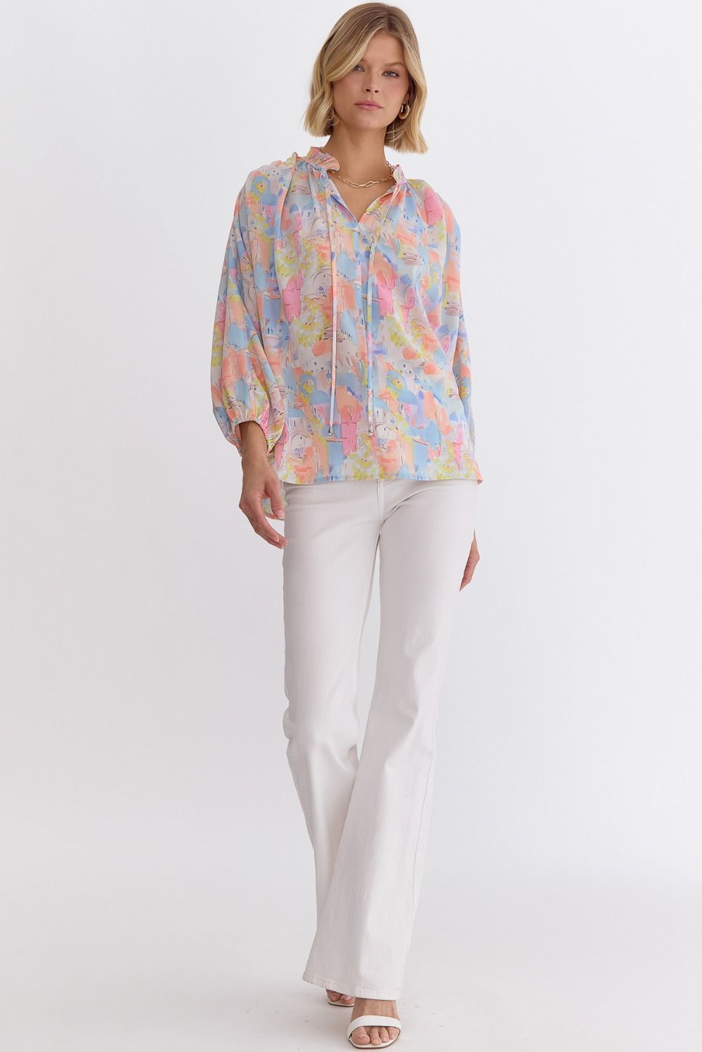 Pink multi printed v-neck 3/4 sleeve top featuring ruffle detail at neck.  image 6