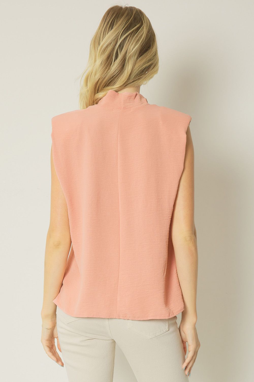 Salmon solid cowl neck sleeveless top featuring shoulder pads. Unlined. Woven. image 3