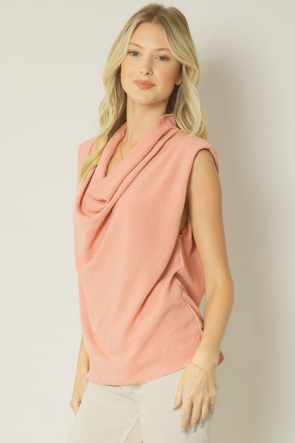 Salmon solid cowl neck sleeveless top featuring shoulder pads. Unlined. Woven. image 1