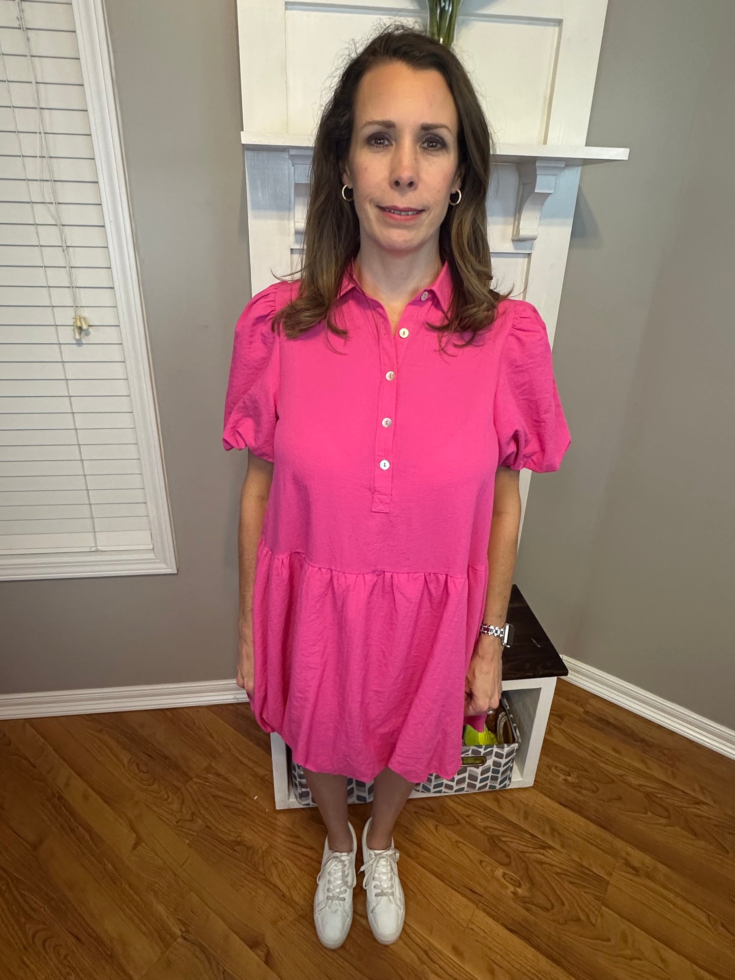 Hot pink solid collared button up dress featuring bubble hem and sleeves.