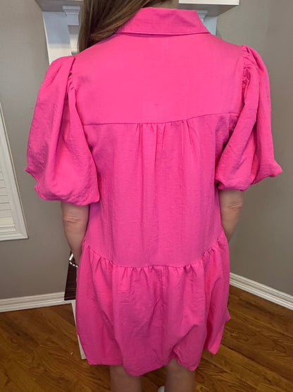 Hot pink solid collared button up dress featuring bubble hem and sleeves.