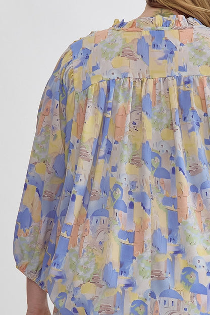 Blue multi printed v-neck 3/4 sleeve top featuring ruffle detail at neck.  image 6