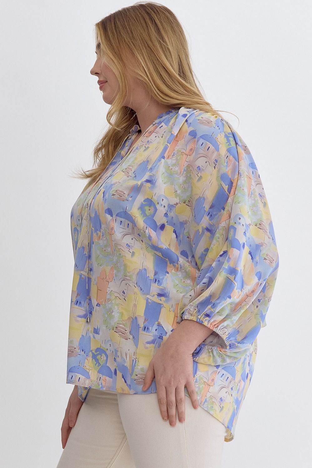 Blue multi printed v-neck 3/4 sleeve top featuring ruffle detail at neck.  image 2