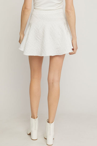 White solid textured flare mini skirt featuring inset shorts. image 3
