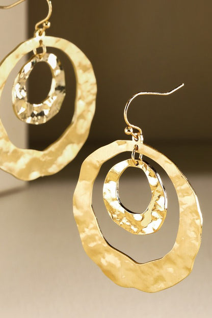 Gold Hammered steel hoop earring  image 0