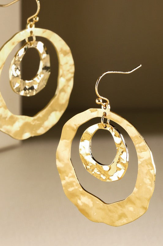Gold Hammered steel hoop earring  image 0