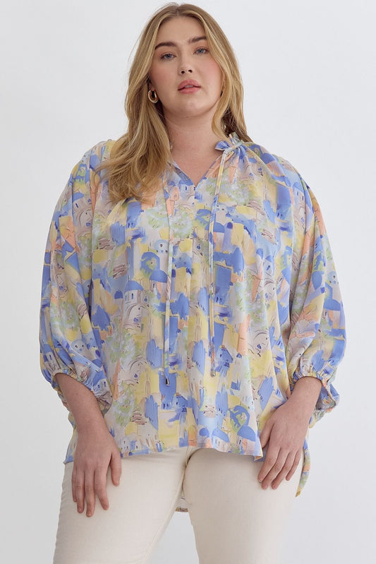 Blue multi printed v-neck 3/4 sleeve top featuring ruffle detail at neck.  image 0