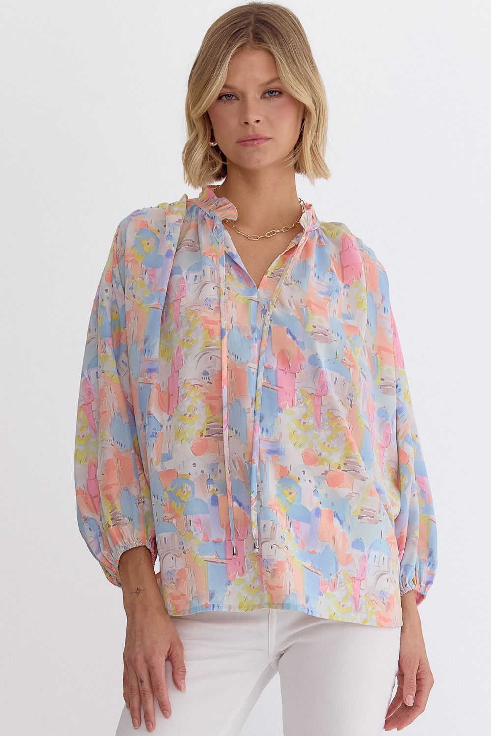 Pink multi printed v-neck 3/4 sleeve top featuring ruffle detail at neck.  image 0