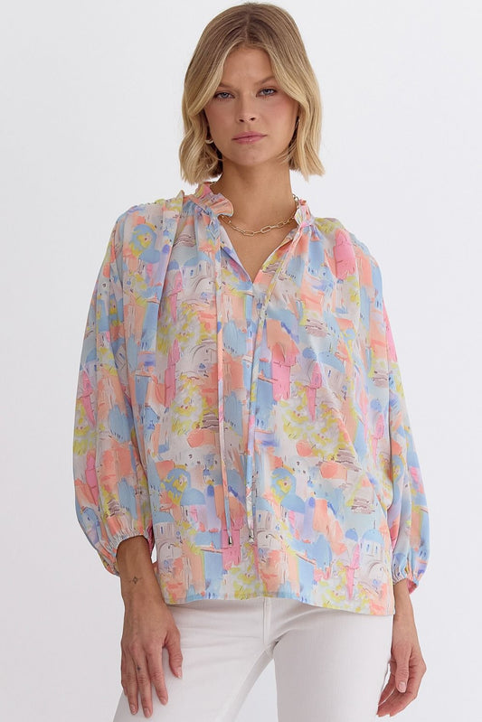 Pink multi printed v-neck 3/4 sleeve top featuring ruffle detail at neck.  image 0