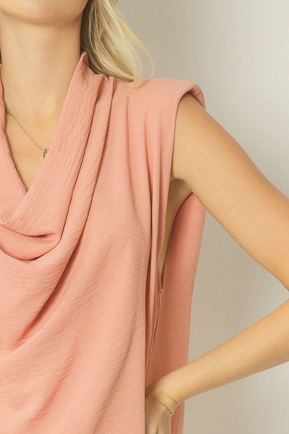Salmon solid cowl neck sleeveless top featuring shoulder pads. Unlined. Woven. image 5