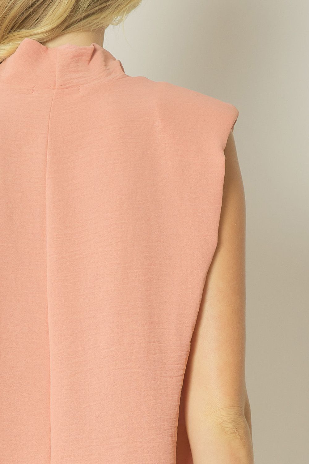 Salmon solid cowl neck sleeveless top featuring shoulder pads. Unlined. Woven. image 6