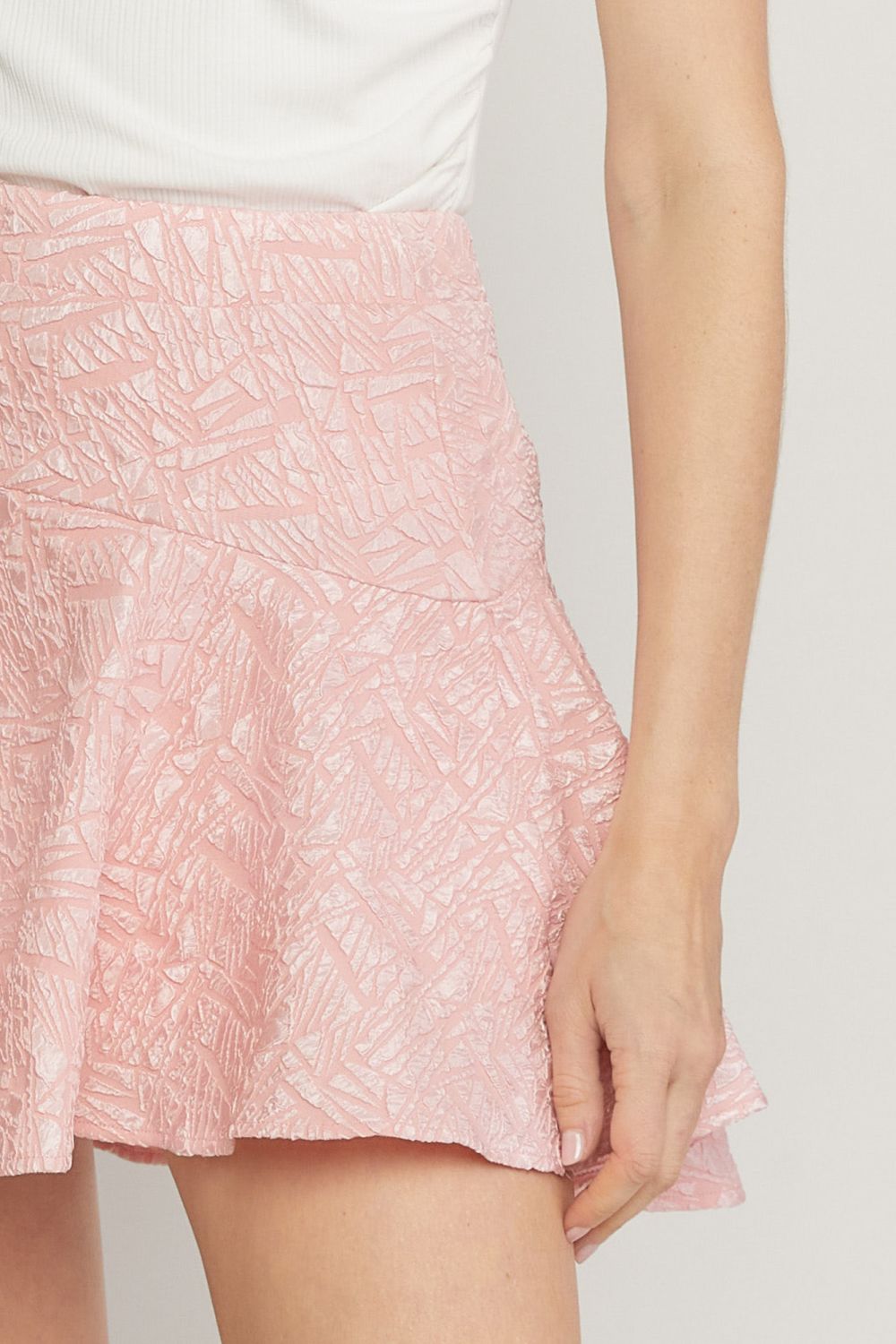 Pink solid textured flare mini skirt featuring inset shorts. image 5