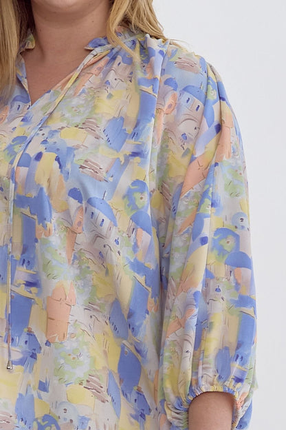 Blue multi printed v-neck 3/4 sleeve top featuring ruffle detail at neck.  image 5