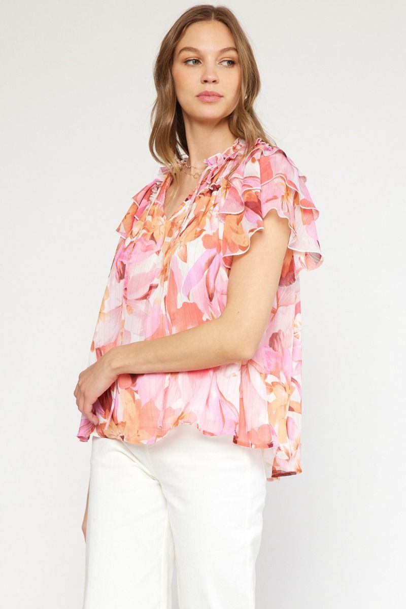 Floral print v-neck ruffle sleeve top featuring self tie at front neck. image 1